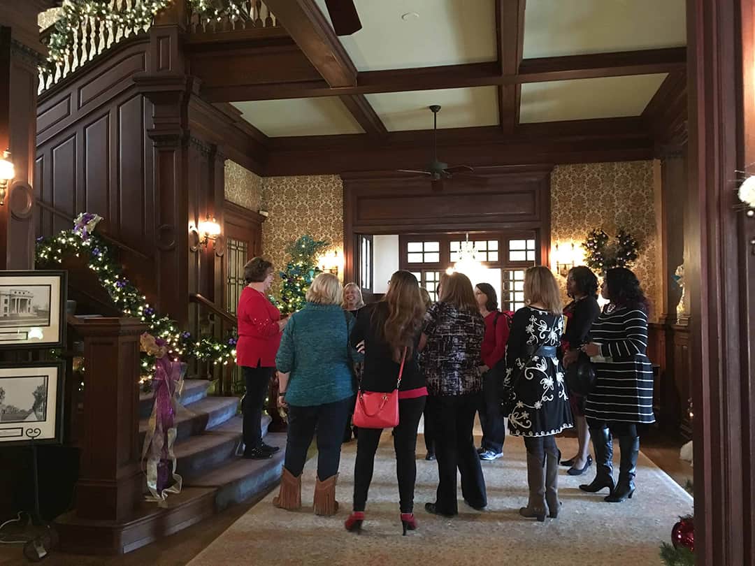 Visitors on a home tour at the Alexander Mansion
