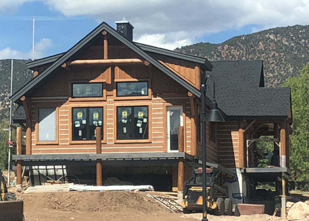 New home Colorado mountain style log cabin under construction hpd architecture + interiors